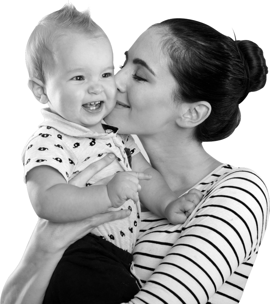 postpartum mom kisses her baby