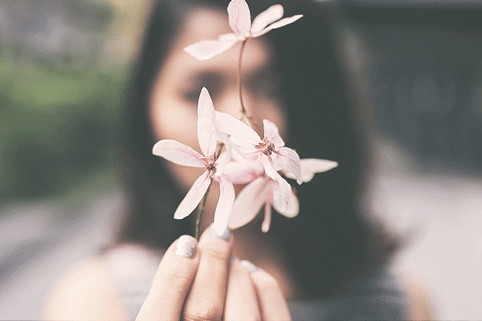 Woman holding a flower 